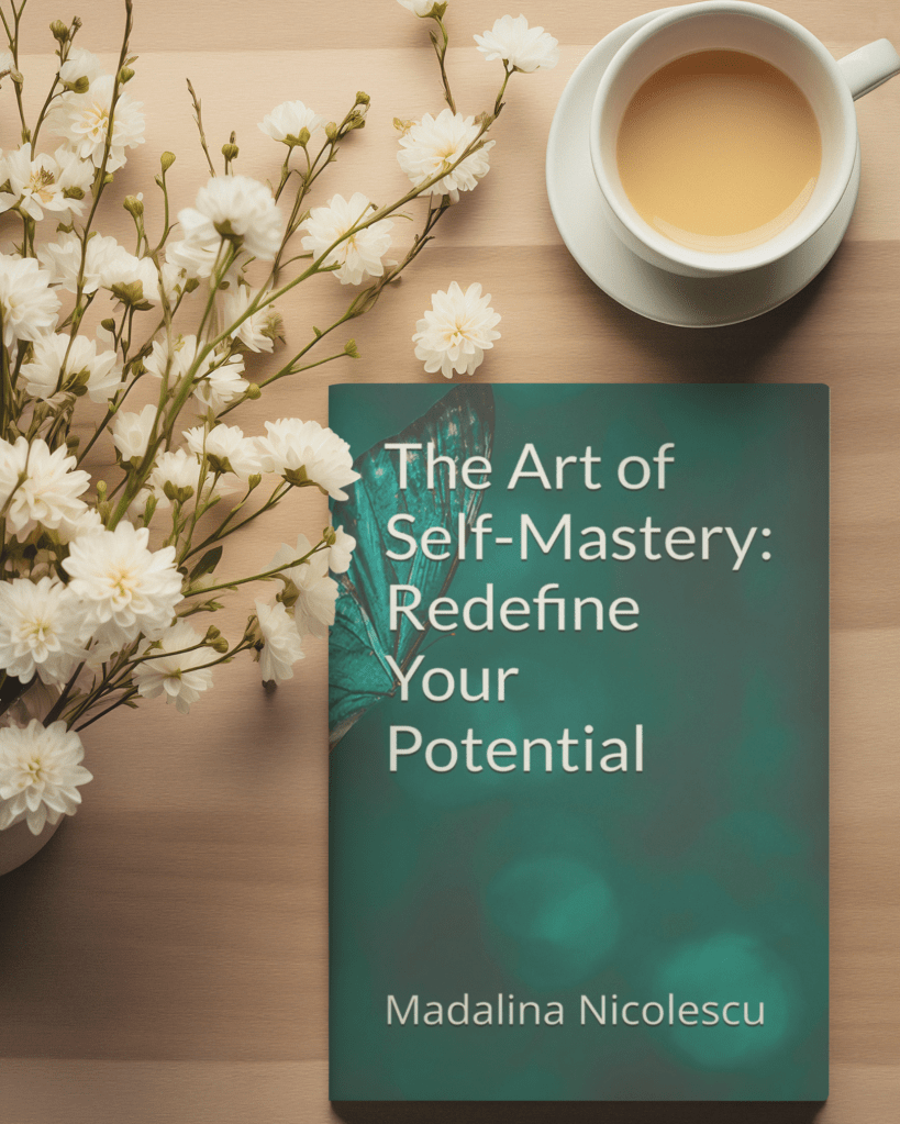 Book titled “The Art of Self-Mastery: Redefine Your Potential” by Madalina Nicolescu placed on a wooden table with white flowers and a cup of tea, symbolising conscious growth and aligned living.