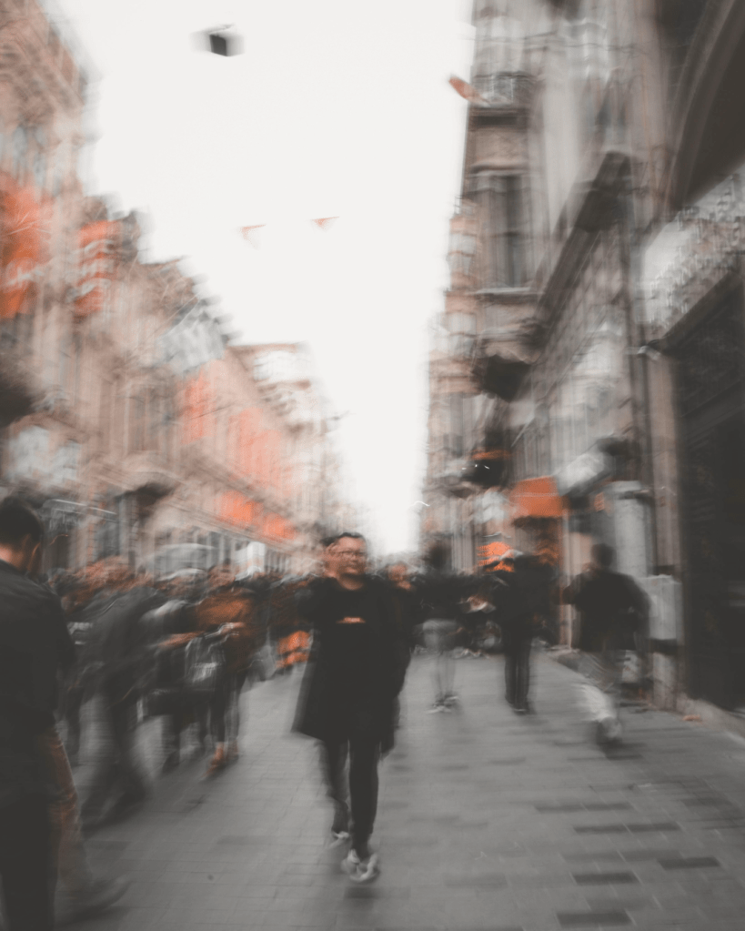Blurred crowded street scene illustrating sensory overload and hypervigilance after leaving an abusive relationship