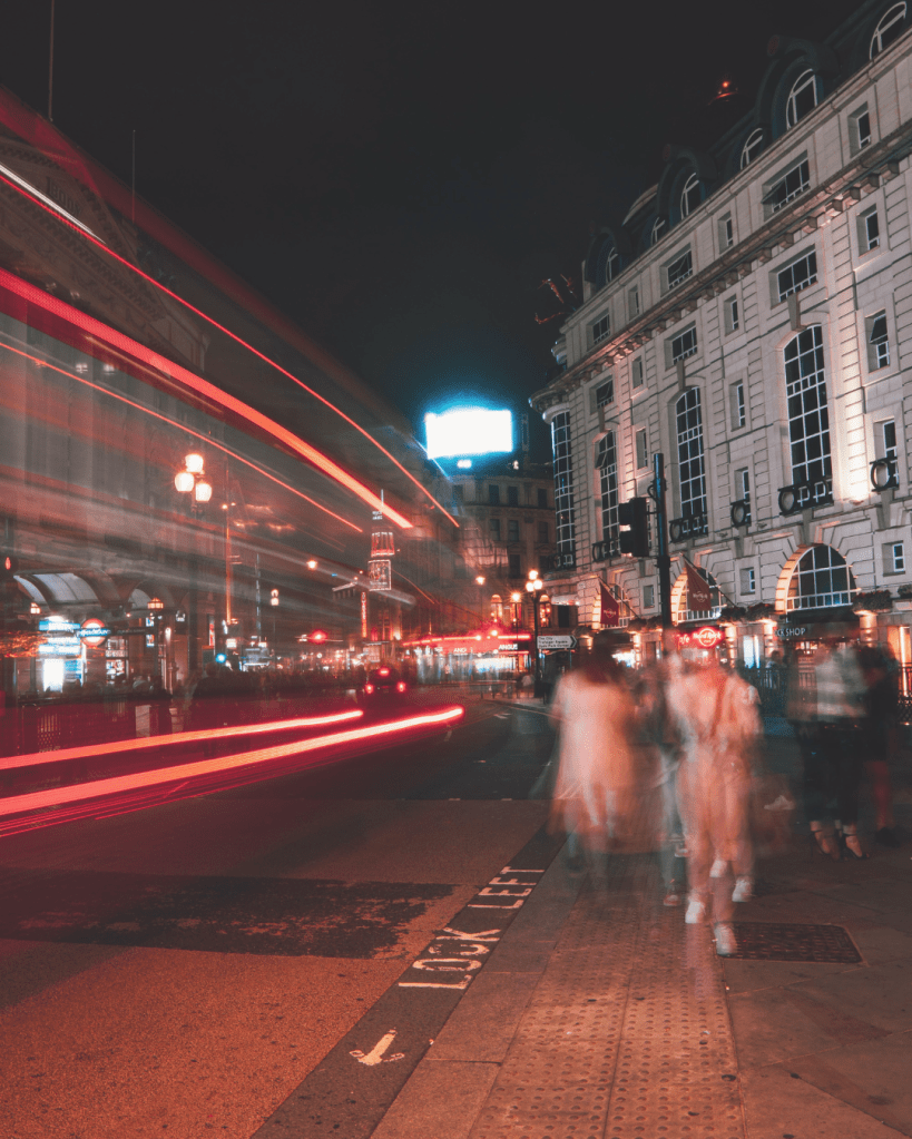 blurred city street at night representing mental overwhelm and disorientation after emotional manipulation and gaslighting