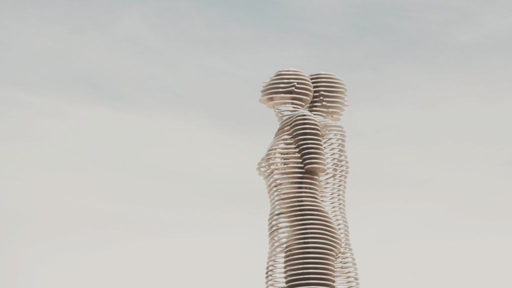 Abstract human figures formed from layered structures, representing human organisation and relational context.