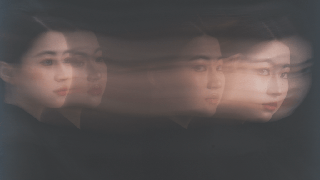 Multiple blurred reflections of a person, representing insight, perception and different layers of understanding.